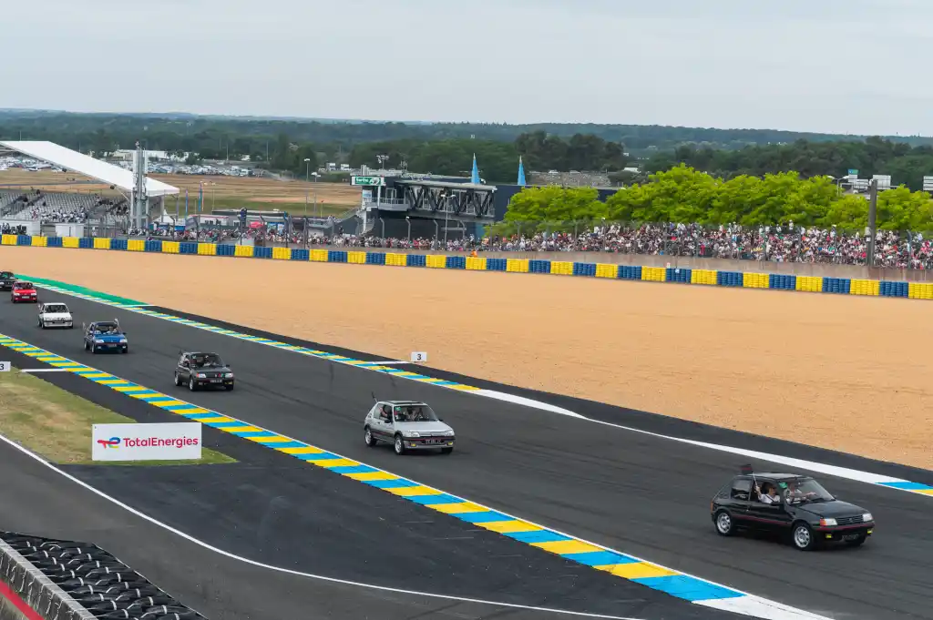 Peugeot 205 and e208 gti at le Mans